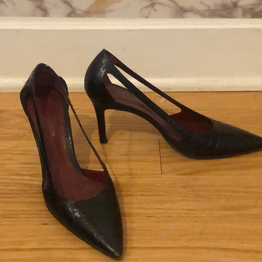 Black leather pumps with red bottoms